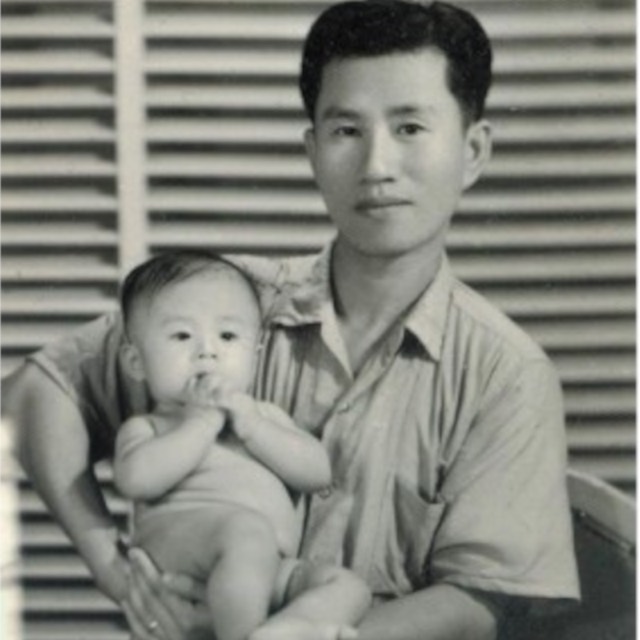 Sheng-Yen Lu as an infant, held in a relative's arms — a black-and-white photograph from 1940s Taiwan